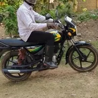 Education Secretary Alex Puhindei using his new motorbike